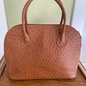 Vera Pella tan ostrich-embossed leather dome-shaped top-handle handbag.